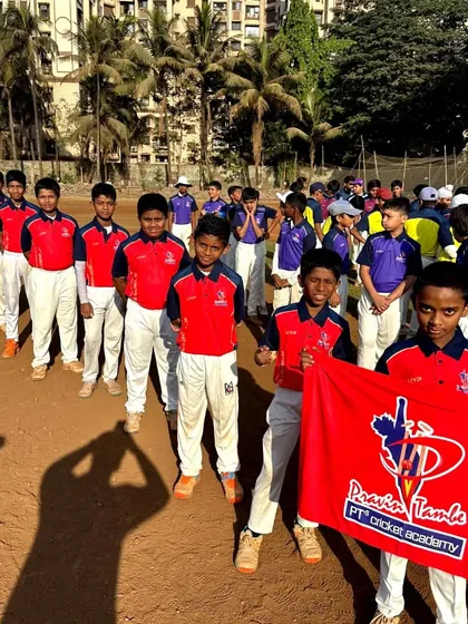 Our U-12 Red Team, lined up and showing their team colors. This is where they learn to play for the badge.