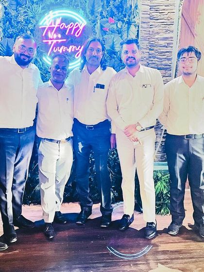 A group photo during a celebratory dinner with my team and colleagues.