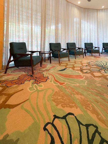 Another angle of the custom carpet and seating at the GCC Hotel. The design uses organic, flowing lines in both the carpet and the architecture to create a sense of harmony and movement.