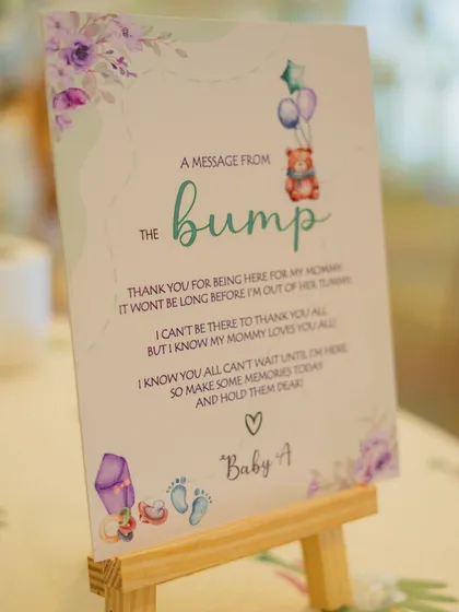 A sweet 'Message from the Bump' adds a deeply personal and emotional touch to the decor. This custom-designed sign thanks guests from the perspective of the baby, creating a heartwarming moment for everyone.