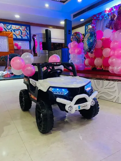 A fun prop for a first birthday party. This mini ride-on toy car can be a great addition for photos and for the birthday boy or girl to enjoy.