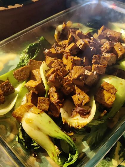 A healthy and flavourful dish of Bok Choy with Black Bean Tofu. The crispness of the steamed bok choy pairs beautifully with the savoury, marinated tofu cubes.