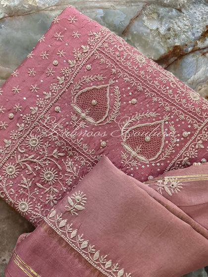 A close-up of the paisley motifs, each centered with a delicate seed pearl.