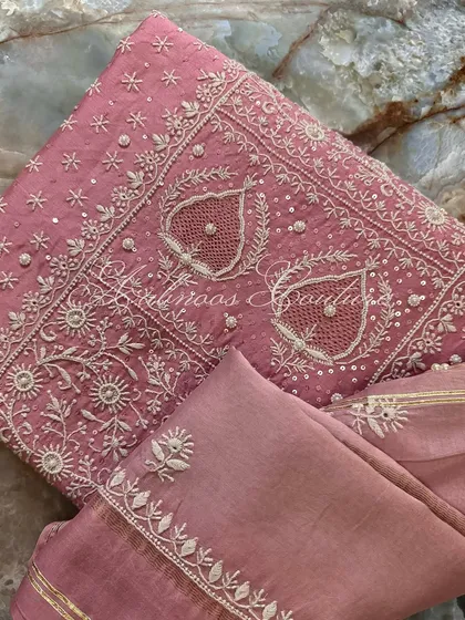A close-up of the paisley motifs, each centered with a delicate seed pearl.
