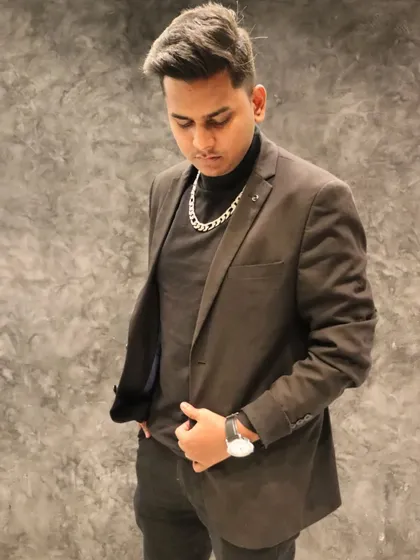 A stylish shot from a recent photoshoot. My personal style is an extension of my brand as a modern and confident DJ.