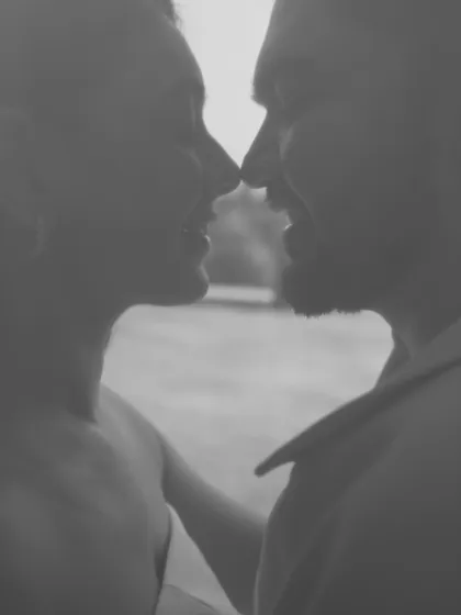 A soft-focus, grainy black and white close-up of the couple about to kiss. This artistic style evokes a sense of nostalgia and pure, unfiltered emotion, focusing entirely on their connection.