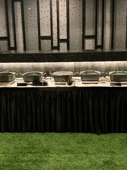 A sharp, all-black setup for a private Diwali party, creating a modern and sophisticated look.