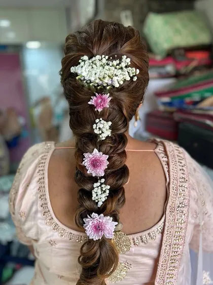 A beautiful, traditional floral braid. I used fresh pink and white flowers to create a stunning pattern down the length of this thick, textured braid.