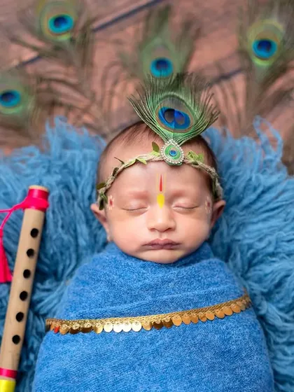 A close-up of our little Krishna, complete with a peacock feather crown and tilak. I pay close attention to every detail to make these cultural themes authentic and beautiful.