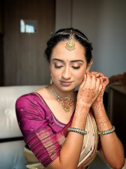 A soft, radiant bridal look for an engagement. This close-up shows the glowing skin, neutral eyeshadow, and elegant finish.