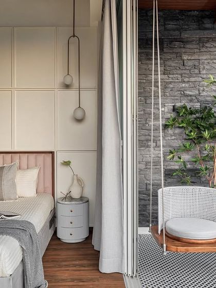 Welcome to the master bedroom of Apartment 1101. We removed part of a wall to open the room to the deck, installing a swing to create a seamless indoor-outdoor experience. The geometric tiles and black flex-stone on the deck add a touch of modern elegance.