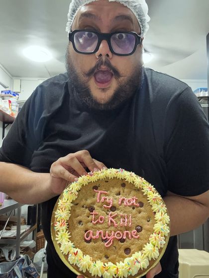 A note to self every day: "Try not to kill anyone". Here I am with one of my first cookie cakes. You can get any sassy quote you want on these giant chocolate chip cookies.