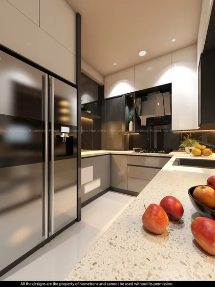 This angle of the kitchen highlights the large side-by-side refrigerator and the clean, uncluttered countertops.