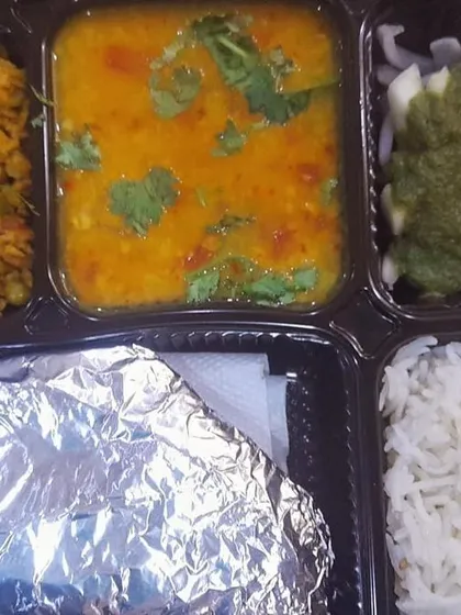 This thali features a tasty vegetable keema made with soya granules, served with dal tadka. A healthy and delicious vegetarian meal.