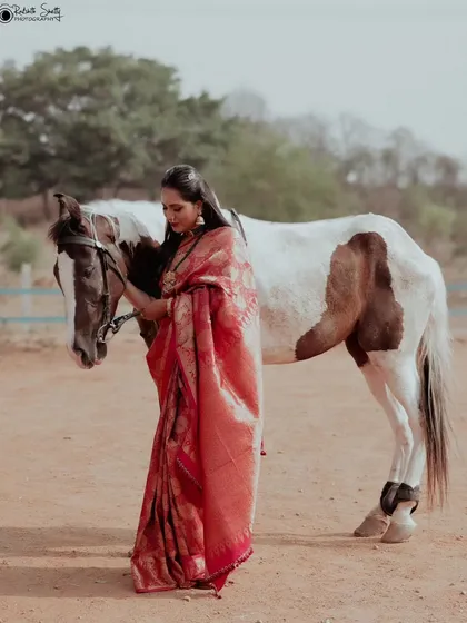 I love bringing unique concepts to life. This editorial fashion shoot combined the elegance of a traditional silk saree with the rustic beauty of an outdoor equestrian setting, creating a memorable and artistic portrait.
