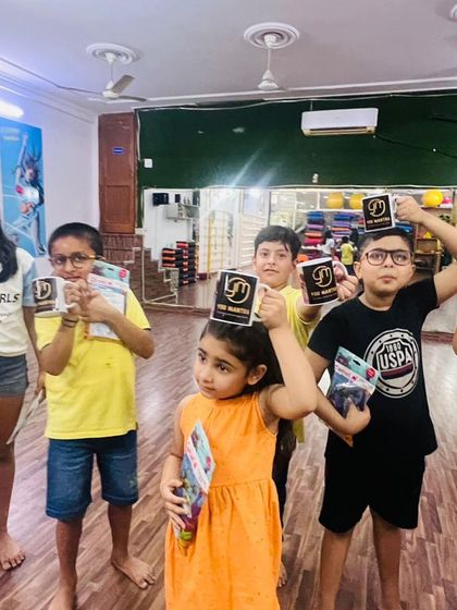 Everyone raising their branded mugs. It’s a small token, but it helps them feel like they are part of the Yog Mantra family.