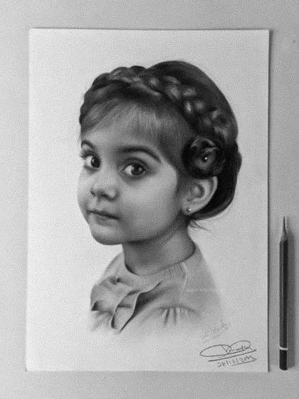 I love drawing portraits of children. This sketch of a little girl captures her innocent expression and the delicate details of her braided hair.