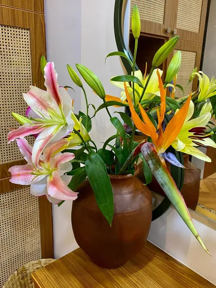 A closer view of the vibrant, fresh flowers that welcome you, reflecting our connection to nature.