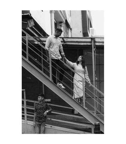 An urban exploration during a family photoshoot. The architecture of the city can provide a unique and modern backdrop for your family's story.