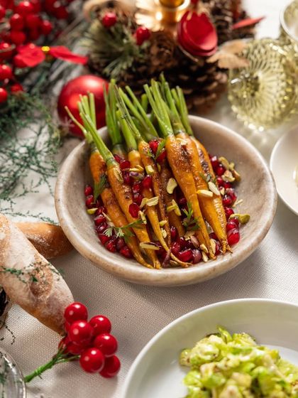 A beautiful shot of the glazed carrots, a colorful and delicious addition to any festive feast.
