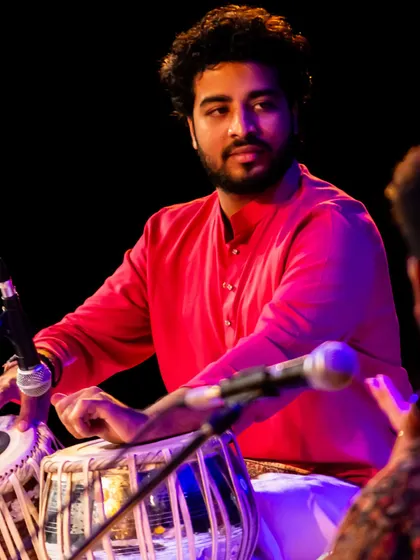 Interacting with a fellow artist on stage during my performance at the Debadhara Festival.