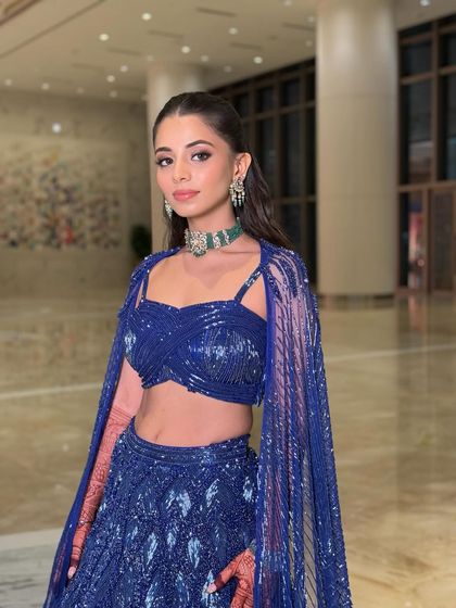 A full-length view of the stunning blue sequined lehenga, showing how the complete look comes together for a head-turning sangeet or reception appearance.