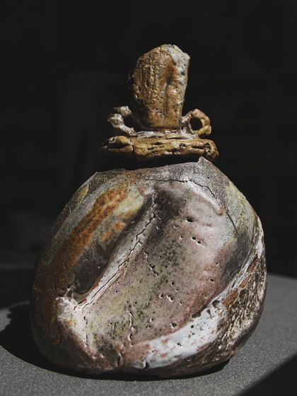 Another angle of the wood-fired sculpture, highlighting the varied colors and textures left by the flames. The process is a reminder that openness in craft helps us all push boundaries and innovate.