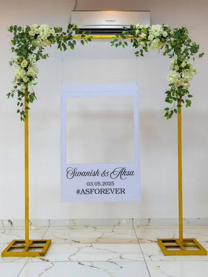 A simple and fun photobooth frame for guests to use. The floral accents tie it into the overall decor of the event.