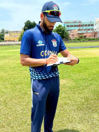 Taking notes during a training session. I am constantly assessing and planning, ensuring that each athlete's program is tailored to their specific needs and goals.