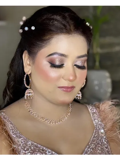 A close-up of a glittery eye makeup look, perfect for a glamorous evening event or reception party.