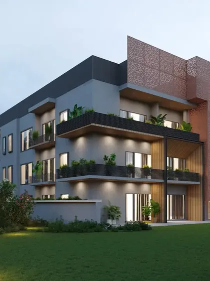 A rear view of the Chattarpur farmhouse, showing its relationship to the private lawn. The design provides multiple outdoor living spaces, including covered balconies and open terraces.