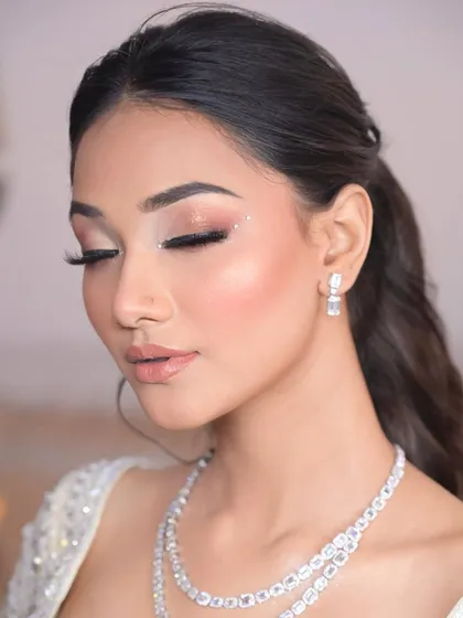 The focus here is the fresh, statement eye makeup. I used a soft pink shimmer with a scatter of delicate crystals near the outer corner for a unique and magical touch.