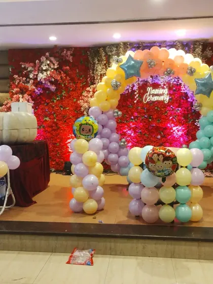 A close-up of the pastel balloon arch for the naming ceremony.