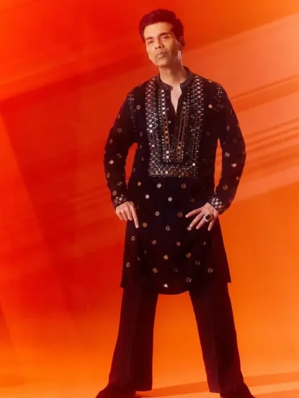 The full look of the celebrity-style mirror-work kurta, paired with flared trousers for a modern silhouette.