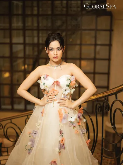 For this look in the GlobalSpa feature, we moved to a grand staircase. The soft lighting and elegant pose create a classic, almost fairytale-like portrait.
