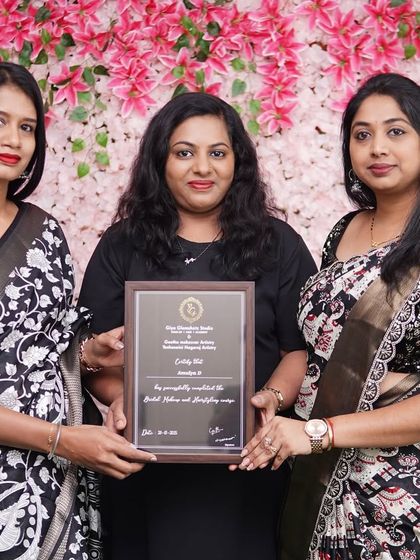 Presenting the final certificate to a student from Batch 15. Each certificate represents a new professional entering the bridal industry.
