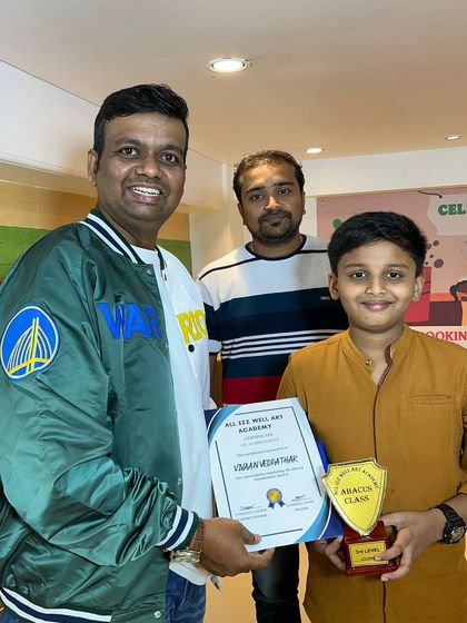 Vivaan Vedpathak, another one of our star students, receiving his certificate and trophy for completing the 3rd level of Abacus.