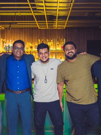 A duplicate of 89, posing with friends and regulars.