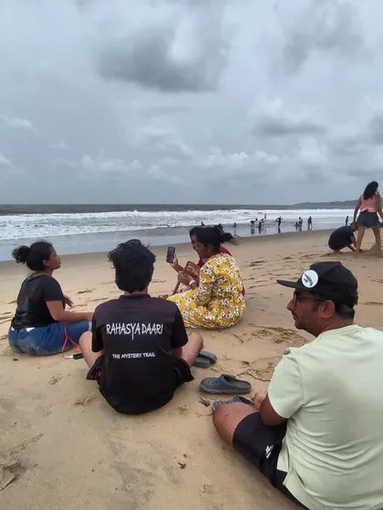 A candid moment of our group relaxing on the sand at Gokarna beach.