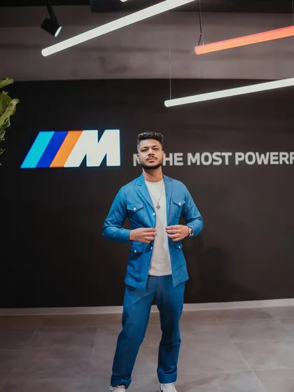 Standing in front of the iconic 'M' logo at the BMW event. Performing for their performance division was a perfect fit, as I always aim to deliver a high-performance show.