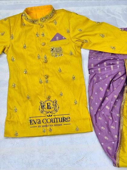 A similar sherwani-style kurta in yellow, paired with a purple dhoti. These sets are perfect for festive occasions.