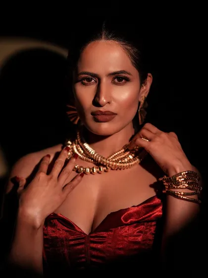 Light and shadow are my tools to sculpt a mood. Here, I used hard lighting to create a dramatic, high-contrast portrait that highlights both the texture of the velvet outfit and the model's powerful presence. This is perfect for a glamorous, editorial look.
