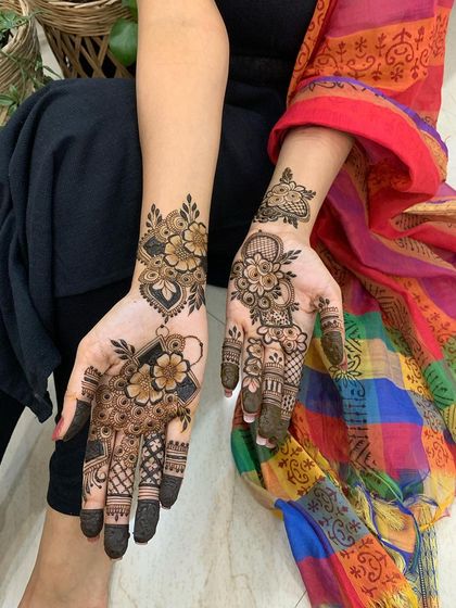 This client chose two different but complementary designs for her hands. Both are beautiful examples of Indo-Arabic floral patterns suitable for any party or festival.