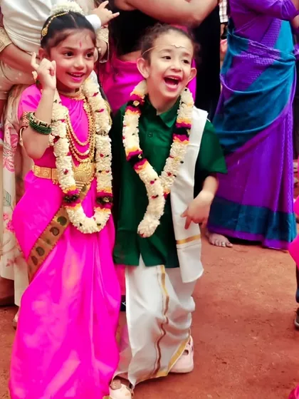 The happy faces of our youngest performers. Dressed in traditional South Indian attire, these two are radiating joy and excitement, ready for their moment in the spotlight.