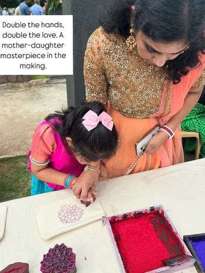 There is nothing more special than seeing generations connect through art. Here, a mother and daughter work together to create a beautiful printed pouch at a wedding celebration. These are the moments of pure love and shared creativity that I cherish.