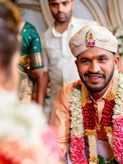 A duplicate of 9, capturing the groom's happy expression during the wedding ceremony.