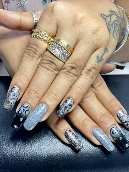 A different view of this dramatic glitter and animal print set, showing how the different elements come together across both hands for a cohesive yet varied look.