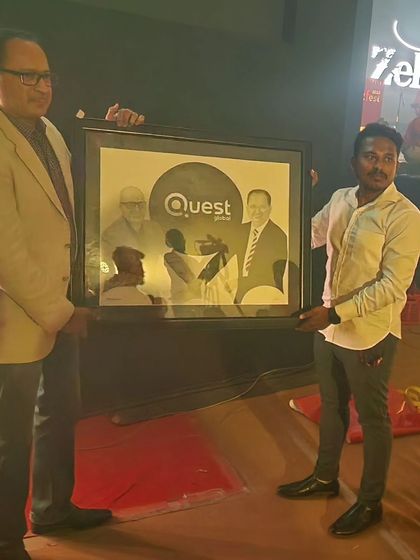 Presenting my artwork to the president of Quest Global during a company event. This was a special corporate commission.