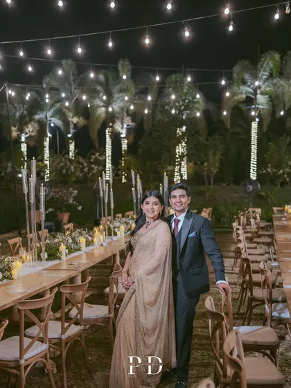 We believe in the magic of intimate moments. This elegant sit-down dinner, set under a canopy of fairy lights, was designed to feel both grand and personal, creating a warm, romantic atmosphere for an evening of heartfelt conversations.