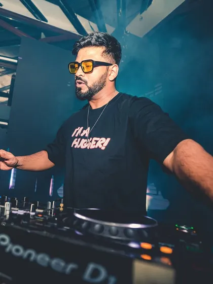 In the zone, mixing tracks at the console. This is where I blend my love for Bollywood with deep house and techno, creating a sound that's completely my own.